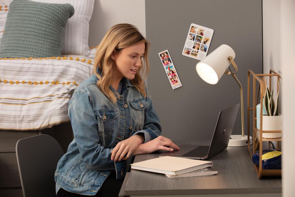 student in a contract furniture furnished college apartment