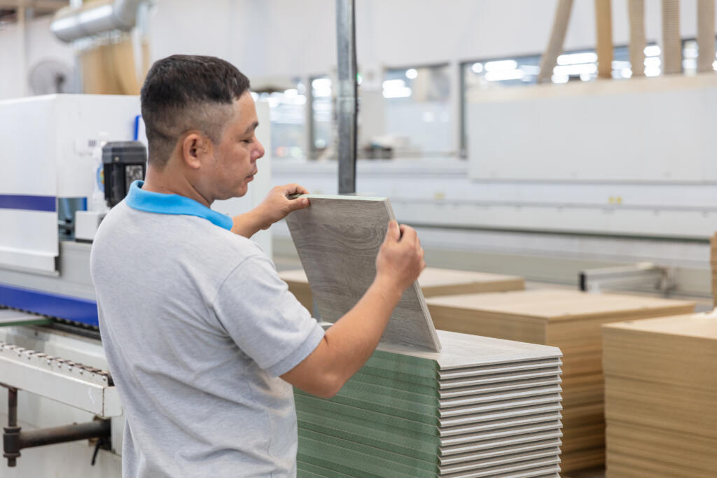 an engineer doing a quality inspection of materials in contract furniture