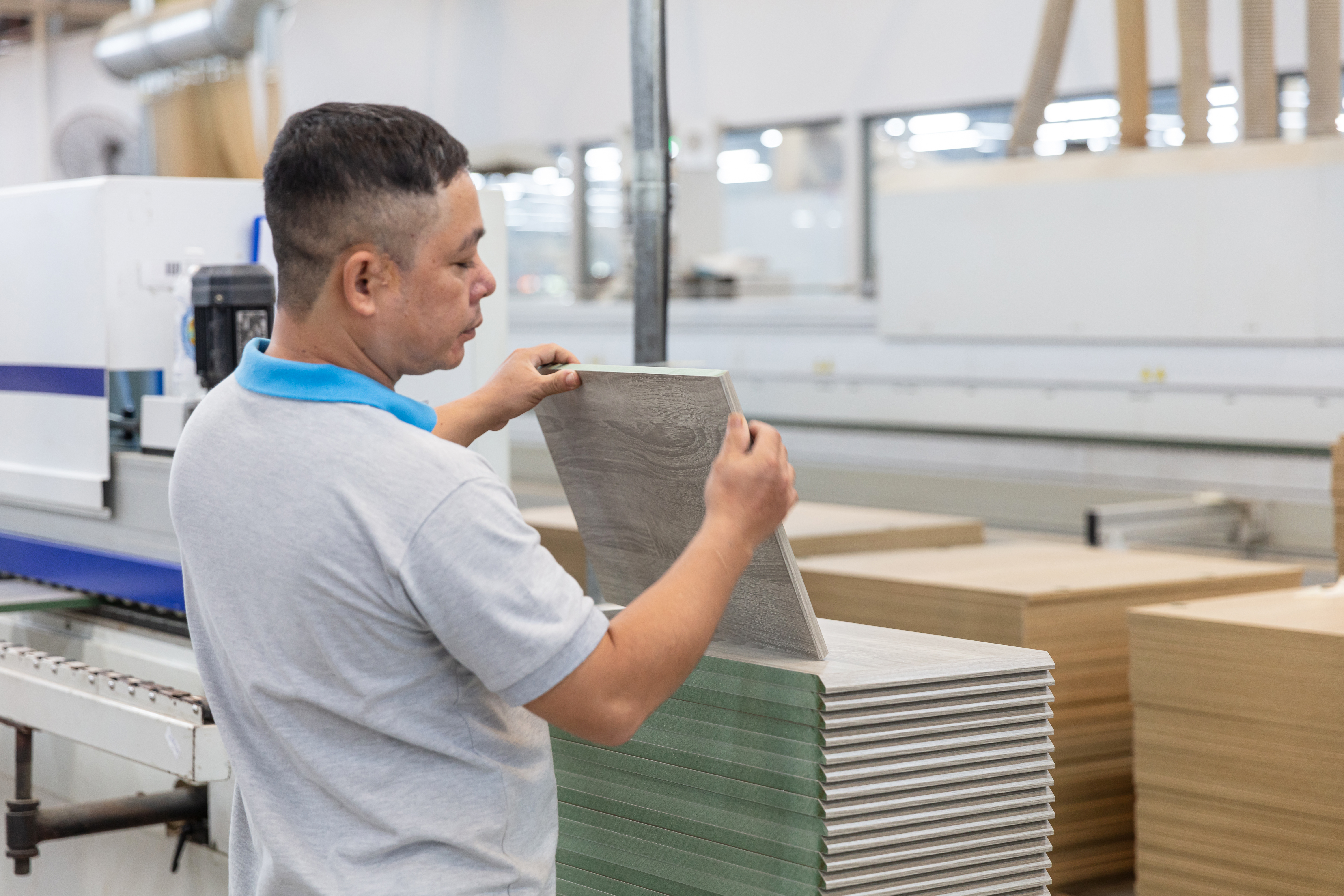 an engineer doing a quality inspection of materials in contract furniture
